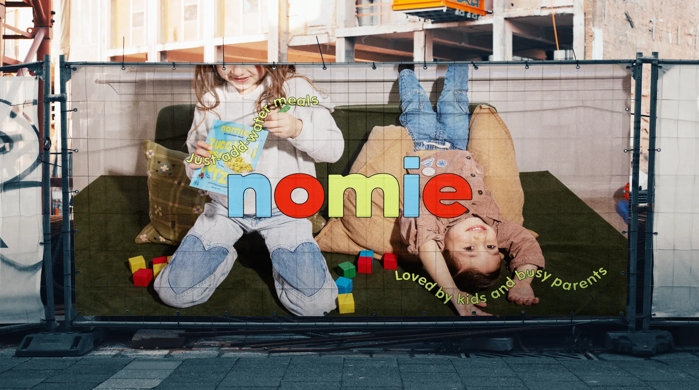 Children playing behind a Nomie banner: loved by kids and busy parents